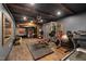 Basement home gym featuring a variety of exercise equipment and a sauna for a complete workout experience at 3633 Jordan Shires Dr, New Hill, NC 27562