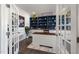 Stylish home office with custom built-in shelving, white cabinets and a functional desk at 3633 Jordan Shires Dr, New Hill, NC 27562
