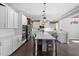 Bright kitchen with white cabinets, a large island, and stainless steel appliances at 3633 Jordan Shires Dr, New Hill, NC 27562