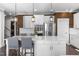 Modern kitchen featuring white cabinets, an island, and stainless steel appliances at 3633 Jordan Shires Dr, New Hill, NC 27562