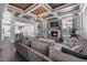 Spacious living room with coffered ceilings, a fireplace, large windows and comfortable seating at 3633 Jordan Shires Dr, New Hill, NC 27562