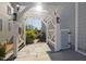 Outdoor living area with a white pergola and stone pavers at 3633 Jordan Shires Dr, New Hill, NC 27562
