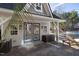 View of pool house with french doors and covered porch and pool in background at 3633 Jordan Shires Dr, New Hill, NC 27562