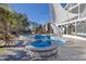 View of the pool and hot tub with lounge seating, string lights, and shade canopies at 3633 Jordan Shires Dr, New Hill, NC 27562