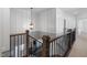 Beautiful staircase with wood and black iron railings at 3633 Jordan Shires Dr, New Hill, NC 27562