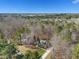 An elevated view showcases the single-Gathering home nestled in a verdant forest, offering a private retreat at 3659 Brooks Bnd, Franklinton, NC 27525