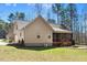 Grassy backyard with a screened porch, firepit and landscaped yard creates the perfect retreat for relaxation at 3659 Brooks Bnd, Franklinton, NC 27525