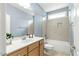 Bright bathroom with single sink vanity and tub-shower combo at 3659 Brooks Bnd, Franklinton, NC 27525