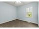 Bright, light-blue bedroom featuring carpet, neutral trim, and large windows at 3659 Brooks Bnd, Franklinton, NC 27525