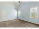 Bright, light-blue bedroom featuring vaulted ceilings, neutral carpet and trim, and bright windows at 3659 Brooks Bnd, Franklinton, NC 27525
