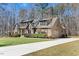 Inviting home featuring a well-maintained lawn, a long driveway, and professionally manicured bushes at 3659 Brooks Bnd, Franklinton, NC 27525