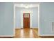 Inviting entryway with a wooden door, sidelights, transom window, and hardwood floors at 3659 Brooks Bnd, Franklinton, NC 27525