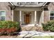 Covered front porch boasts stone accents and a beautiful wood door with sidelights, adding character to this home at 3659 Brooks Bnd, Franklinton, NC 27525