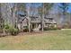 Home's charming exterior showcases manicured front lawn and established trees and shrubs providing great curb appeal at 3659 Brooks Bnd, Franklinton, NC 27525