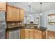 Well-appointed kitchen featuring granite countertops, stainless steel appliances, and a mosaic tile backsplash at 3659 Brooks Bnd, Franklinton, NC 27525