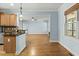 Open kitchen featuring granite countertops, stainless steel appliances, and hardwood floors at 3659 Brooks Bnd, Franklinton, NC 27525
