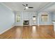Spacious living room featuring a fireplace, hardwood floors, and ample natural light at 3659 Brooks Bnd, Franklinton, NC 27525