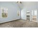 Spacious main bedroom featuring vaulted ceilings, neutral carpet and trim, and bright windows at 3659 Brooks Bnd, Franklinton, NC 27525