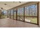 Screened-in porch offering a tranquil outdoor space with views of the wooded backyard at 3659 Brooks Bnd, Franklinton, NC 27525