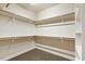 Spacious walk-in closet with carpeted floor and built-in shelving at 3659 Brooks Bnd, Franklinton, NC 27525
