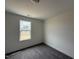 Bedroom with neutral walls, carpet flooring and a bright window with natural light at 394 Springtooth Dr, Zebulon, NC 27597