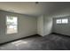 Bedroom featuring neutral walls, carpet flooring and bright windows with natural light at 394 Springtooth Dr, Zebulon, NC 27597