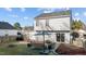Backyard patio view with sliding glass doors and seating area at 402 Homestead Park Dr, Apex, NC 27502