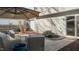 Outdoor patio with comfortable wicker furniture and umbrella for relaxation at 402 Homestead Park Dr, Apex, NC 27502