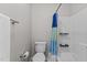 A standard toilet and tub-shower combination in the bathroom at 402 Homestead Park Dr, Apex, NC 27502