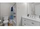 A well-lit bathroom with a tub-shower combination and a vanity at 402 Homestead Park Dr, Apex, NC 27502