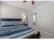 A comfortable bedroom with a view into an ensuite bathroom at 402 Homestead Park Dr, Apex, NC 27502