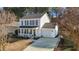 Charming two-story home boasts a welcoming front porch, attached garage, and well-maintained landscaping at 402 Homestead Park Dr, Apex, NC 27502