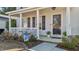 Inviting front porch with white railing, seasonal decorations, and a view into the front door at 402 Homestead Park Dr, Apex, NC 27502