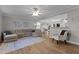 Spacious living room featuring hardwood floors, an open layout, and modern decor at 402 Homestead Park Dr, Apex, NC 27502