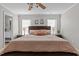 A primary bedroom with a ceiling fan and stylish decor at 402 Homestead Park Dr, Apex, NC 27502