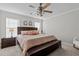 A spacious main bedroom with stylish decor and a ceiling fan at 402 Homestead Park Dr, Apex, NC 27502