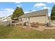 Spacious backyard with deck, fire pit, and bench seating, perfect for gatherings at 408 E Maple Ave, Holly Springs, NC 27540