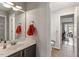 Hall bathroom with single sink and vanity at 408 E Maple Ave, Holly Springs, NC 27540