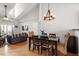 This dining area features an open layout with hardwood floors at 408 E Maple Ave, Holly Springs, NC 27540