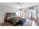 Spacious main bedroom with ceiling fan and lots of natural light at 408 E Maple Ave, Holly Springs, NC 27540