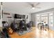 Office space with multiple monitors, comfortable chairs, and natural light from the bay window at 408 E Maple Ave, Holly Springs, NC 27540