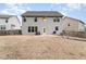 Spacious backyard with a patio and well-maintained lawn at 410 Pintail Ct, Durham, NC 27704