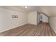 Bedroom featuring wood-look floors, TV mount, and lots of light at 410 Pintail Ct, Durham, NC 27704