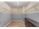 Large walk-in closet with ample shelving, two-tone paint, and a dresser at 410 Pintail Ct, Durham, NC 27704