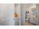Clean bathroom with a toilet, sink, and a view into the laundry area featuring a washer and dryer at 416 Belgian Red Way, Wake Forest, NC 27587