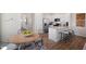 Beautiful kitchen and breakfast area with granite countertops, stainless steel appliances, and wood floors at 416 Belgian Red Way, Wake Forest, NC 27587