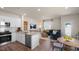 Inviting kitchen and living room offer an open layout, modern appliances, and comfortable seating at 416 Belgian Red Way, Wake Forest, NC 27587