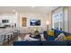 Open-concept living room connected to the kitchen, featuring stylish décor and comfortable seating at 416 Belgian Red Way, Wake Forest, NC 27587