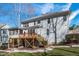 Well-maintained backyard featuring a lush lawn, wood deck, and stairs to the grassy yard at 4228 Bibleway Ct, Holly Springs, NC 27540