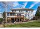 The backyard has a screened porch with a wood deck that goes to the backyard with a grassy area at 4228 Bibleway Ct, Holly Springs, NC 27540